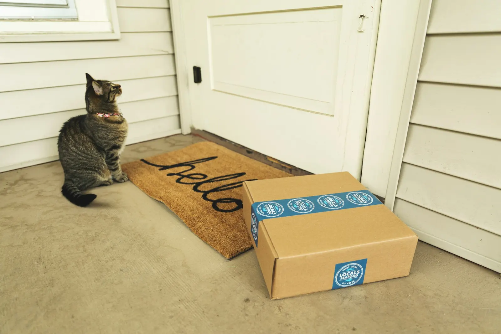 A box of consumable products sitting on a doorstep